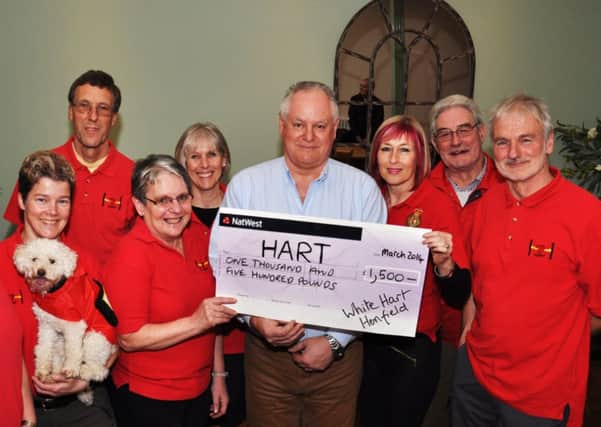White Hart landlord Gyles Culver presents a cheque for £1,500 to HART (Henfield Area Response Team) members - the result of pub quizzes. Pic Mike Beardall, Oakfield Media SUS-141003-165749001