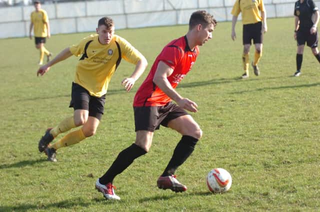 Ben Billings on the ball for Rye United in the defeat to Hassocks. Picture by Simon Newstead