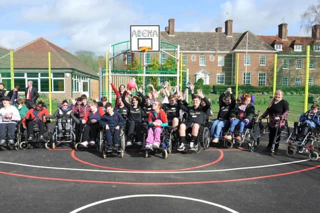 JPCT 070314 Official opening of Ingfield Manor School's new outdoor multi-purpose games area followed by fun wheelchair basketball competition between CASCO staff and school students. It was funded entirely by a donation from local company CASCO. Photo by Derek Martin SUS-140703-160325001