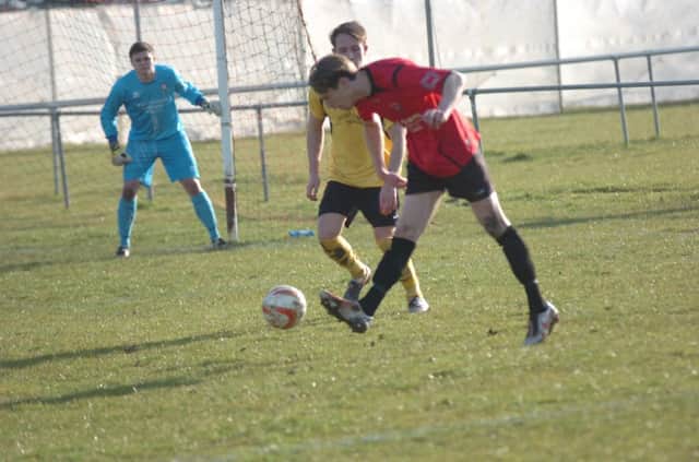 Evan Archibald on the ball for Rye United against Hassocks last weekend. Picture by Simon Newstead