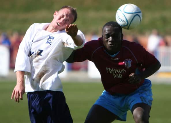 Tim Olorunda (right) contests a header during Hastings United's last home game against Corinthian-Casuals back in April 2007. Picture by Jake Badger