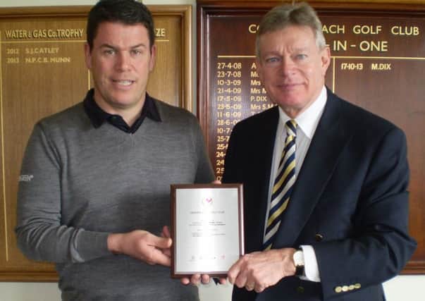 Cooden Beach Golf Club professional Shaun Creasey and general manager Keith Wiley receive the award.