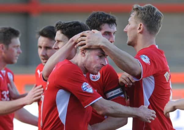 Crawley's Mike Jones scores against Colchester (Pic by Jon Rigby)