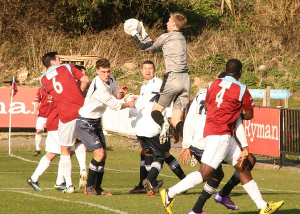 Corinthian-Casuals goalkeeper Danny Bracken claims a cross against Hastings United on Saturday. Picture by Terry S. Blackman