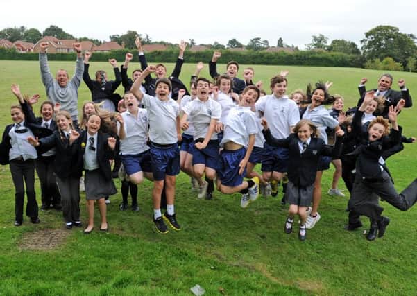 JPCT 18-07-12 S12290086X Tanbridge House school students, jump for joy, new running facilities to be located at school site -photo by Steve Cobb ENGSUS00120120718143901