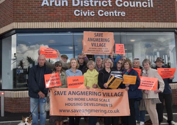 Save Angmering Village campaigners handing in letters against a planned development in Angmering. SUS-140319-121630001