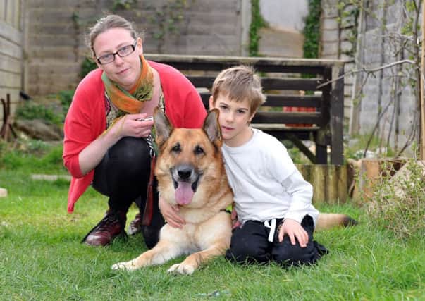 W11390H14 Cher Lewis with German Shepherd Max and her eight-year-old son Marlin