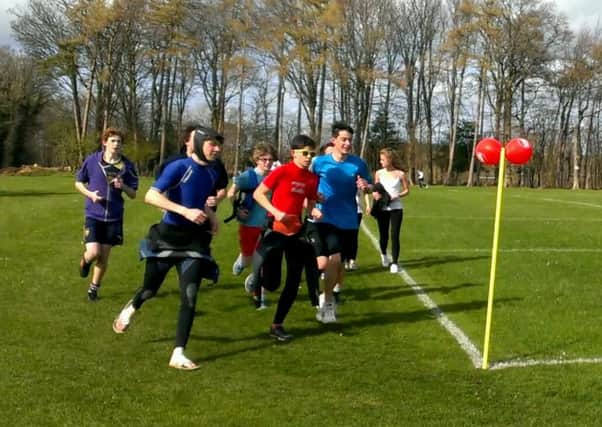 Students and staff run, walk and somersault the Sports Relief Mile at Steyning Grammar School