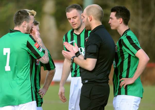 Burgess Hill FC (black and green) v Hythe (blue). Pic Steve Robards SUS-140323-155241001