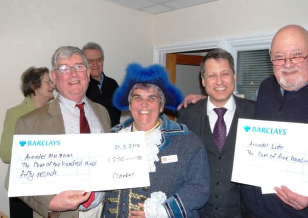 Pictured, from left, are Michael Heathcote, treasurer of Arundel Museum Society, Arundel town crier Angela Standing, Paul Clarke, director of Clarkes Estates, and David Wood, chairman of the trustees of Arundel Lido SUS-140324-112614003