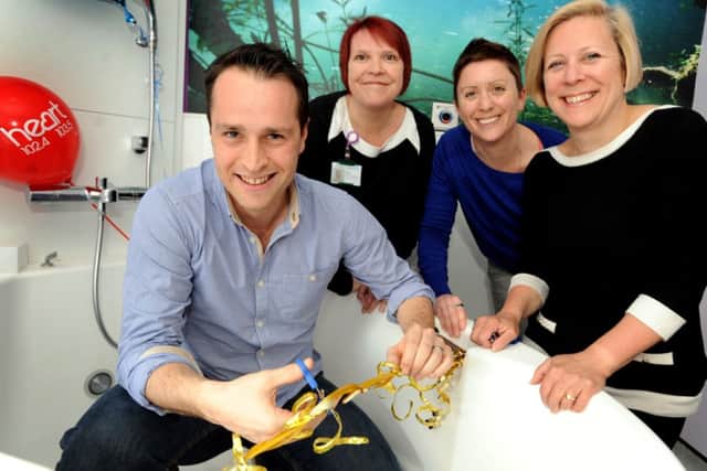 Tom Evans from Heart FM sits in the pool and officially opens the new birthing pool room in the Princess Royal Hospital. Pictured Nicky Van Eerde (Maternity and Gynaecological Manager at the PRH), Jenny Davidson (Deputy Head of Midwifery and Gynaecology BSUH) and Helen O'Dell (Head of Midwifery and Director of Women and children BSUH) SUS-140327-165446001