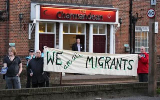 Protestors outside the UKIP public meeting, at the Charmandean Centre SUS-140104-104530001