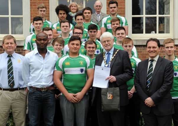 JPCT 310314 S14140234x Horsham RUFC Colts meet Chairman of Horsham District Council, Cllr Philip Circus, before heading out to Saint Maixent. captain Kyle Fairs receives letter to give to Mayor -photo by Steve Cobb SUS-140331-170136001