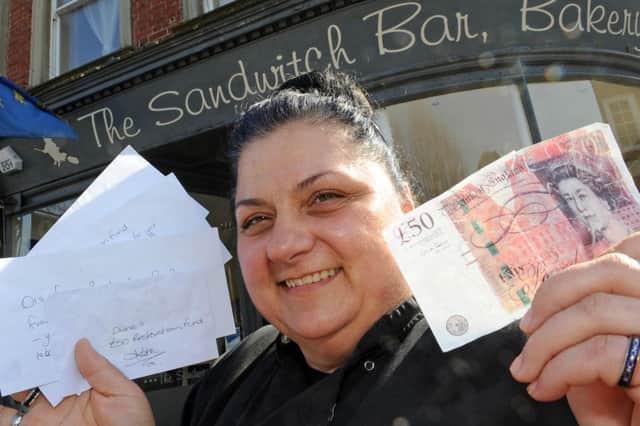 WH 010414 Diane Guest, Sandwich Bar, Rowlands Road, Worthing. Her shop worker took a fake £50 note but when she discussed it with other traders to warn them, a few days later four anonymous envelopes with cash were posted through her door, entitled 'Di's £50 restoration fund' - traders had grouped together to pay back some of her losses, in a sign of community spirit. Photo by Derek Martin SUS-140104-173259001