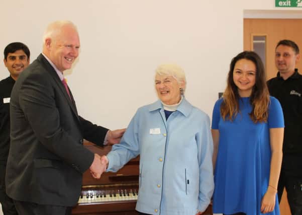 Jean donates a piano to Rye school SUS-140204-123416001