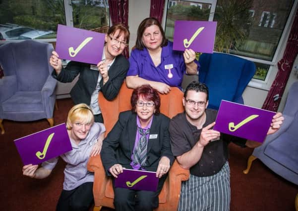 Staff at the Darlington Court care home celebrate the result of their latest inspection