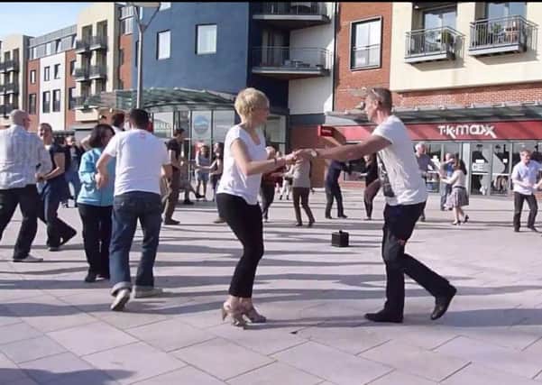 Members of Horsham Salsa take part in a flash mob in Horsham town centre as part of a world record attempt