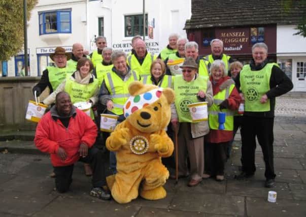 Horsham Rotary Club members collecting for good causes with Pudsey and Dave Benson Philips ENGSUS00120130701142419