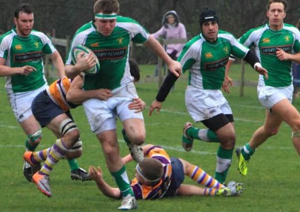 Johnny Whiting powers through against Uckfield and (below) Jamie Gibbs in action for Horsham. Pics by Rob Wright