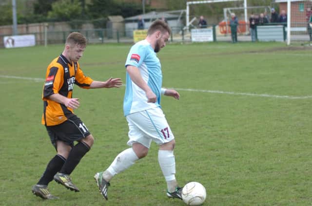 Jordan Woodley on the ball during Hastings United's 2-1 win away to Three Bridges on Saturday