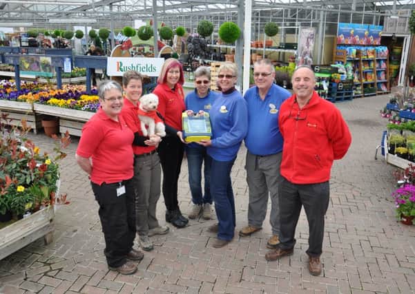 Rushfields Plant Centre staff receive their new heart defibrillator from the HART team. Pic by Mike Beardall, Oakfield Media. www.mikebeardall.com SUS-140804-170728001