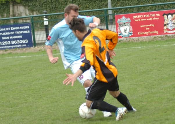Tom Vickers goes in for a tackle during Hastings United's 2-1 win away to Three Bridges last weekend. Picture by Simon Newstead