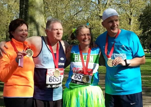 Linda Russell, Kevin Walker, Helen Pratt and Jon Lavis with their London marathon Medals in St James park