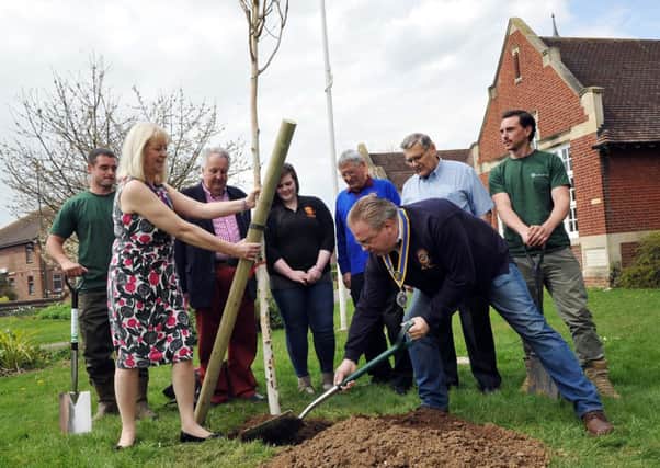 Littlehamptons Deputy mayor Jill Long and Rotary president Alan Moss plant the tree                       L15566H14