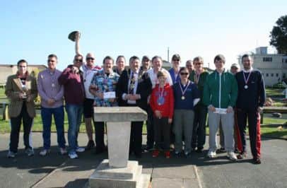 Winners at the Masters minigolf at Splash Point with mayor Bob Smytherman SUS-140416-100633001