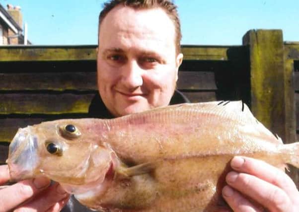 Simon Faber pictured with a Migrim, which was caught in Littlehampton. SUS-140422-112431001