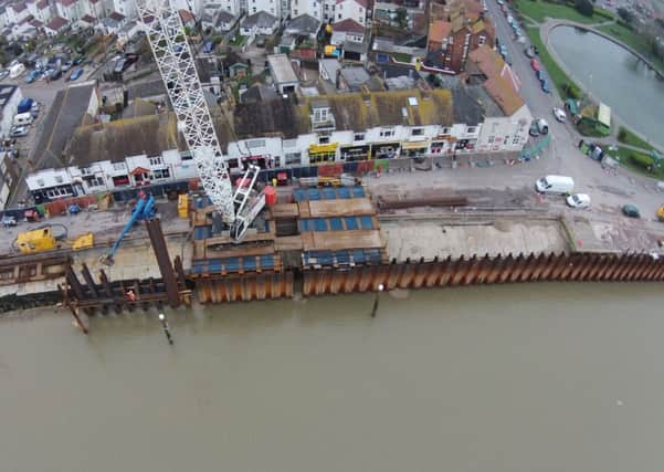 Aerial photo of the completed tidal wall part of the flood defences on the River Arun SUS-140424-134159001