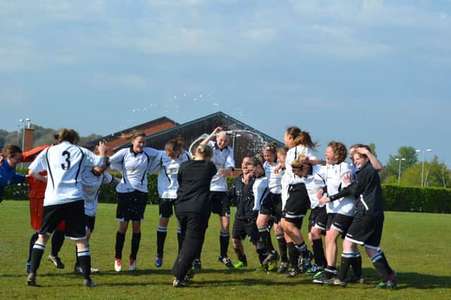 The champagne flows as Bexhill United Ladies celebrate winning the South East Counties Women's Football League Premier Division title