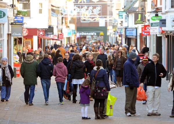 Shoppers in West Street, Horsham. Photo by Derek Martin ENGPPP00320131227100513