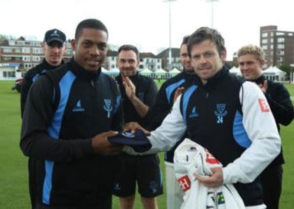 Chris Jordan receives his cap from Sussex captain Ed Joyce during the LV=County Championship game against Middlesex