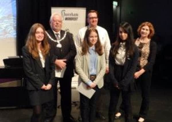 The three secondary school short story competition winners with the judges