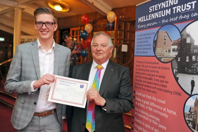 Jack Maylam receives the Steyning Millennium Trust award  from chairman John Stevenson D14181137a