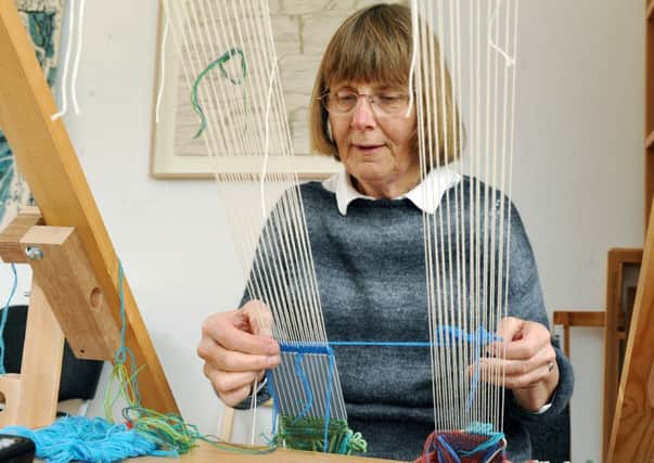 L17520h14

Tapestry Exhibiton at the Mill House Angmering. Jenny Lacey at her Loom SUS-140424-161850001