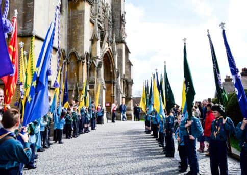 Flags raised outside the cathedral for the Scouts annual St Georges Day parade