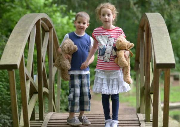 William and Alice Waghorn with teddies SUS-140429-111050001