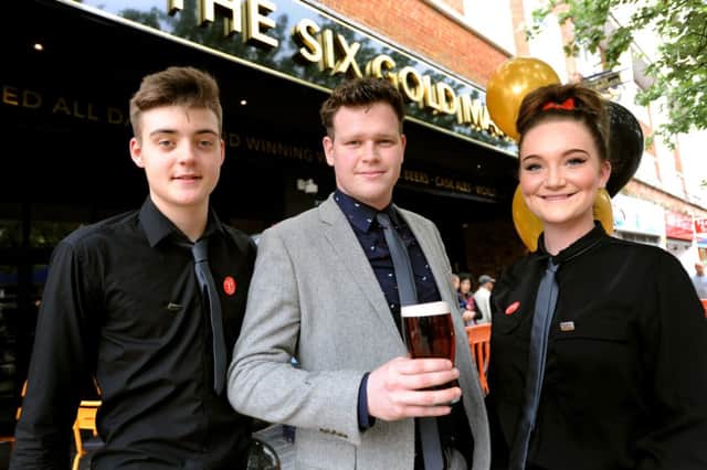 Manager of Wetherspoon's The Six Golden Martlets, Garrie Richardson (centre) with his colleagues Joe Bosher and Bethany Holden on the pub's official opening day Tuesday 29th April. Pic Steve Robards SUS-140429-131922001