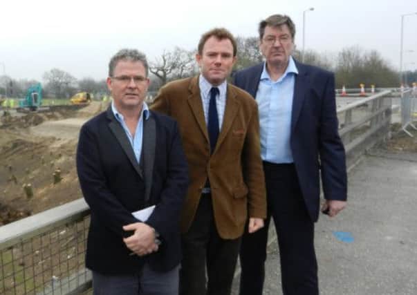 James Stewart, left, with Nick Herbert and Paul Dendle outside the Crossbush road works, on Friday. ENGSUS00120120320191641