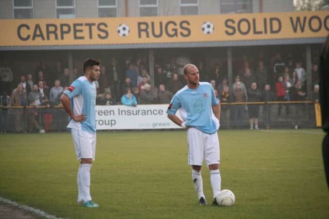 Russell Eldridge (right) and Taser Hassan (left) stand over a free kick during Hastings United's Ryman Football League Division One South play-off semi-final away to Folkestone Invicta. Picture by Terry S. Blackman