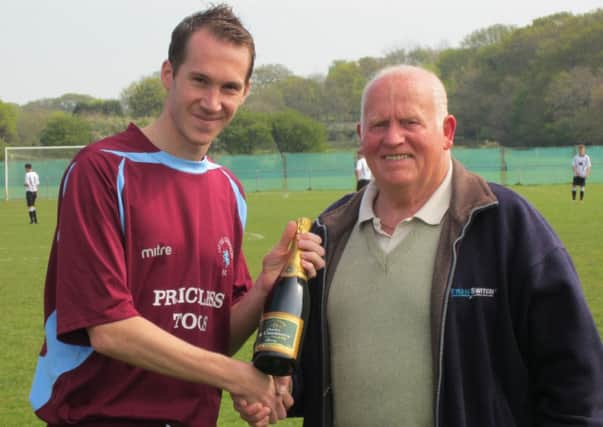 Lewis Hole receives his Little Common Supporters' Player of the Year award from Peter Burton