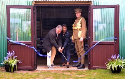 MP Tim Loughton and Cllr Debbie Kennard cut the ribbon to launch the new Nissen hut
