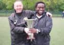Three Bridges U10s manager Simon Rollings (left) and Richard Midadje (right) holding the cup SUS-140428-172344002