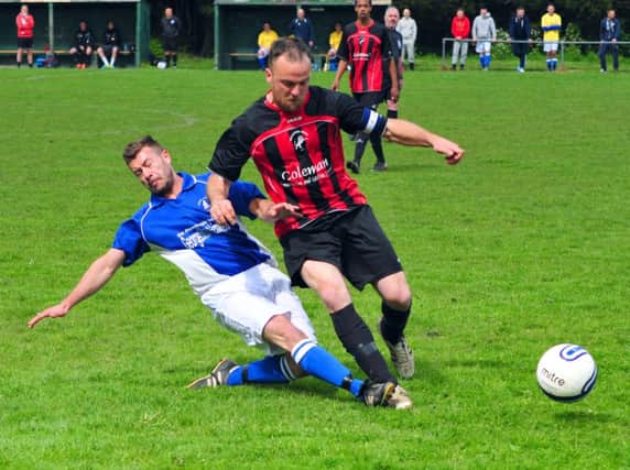 Action from Hollington United's extra-time victory over Rock-a-Nore on Saturday. Picture by Steve Hunnisett (fh18010a)