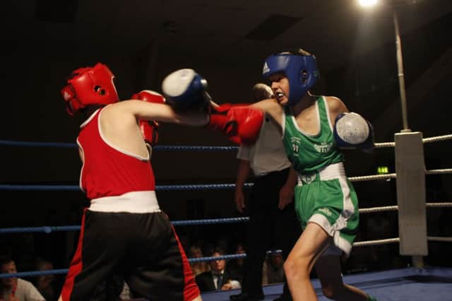 William Badrock (right) throws a right hand during a West Hill Boxing Club show at the Hollington Community Centre last autumn