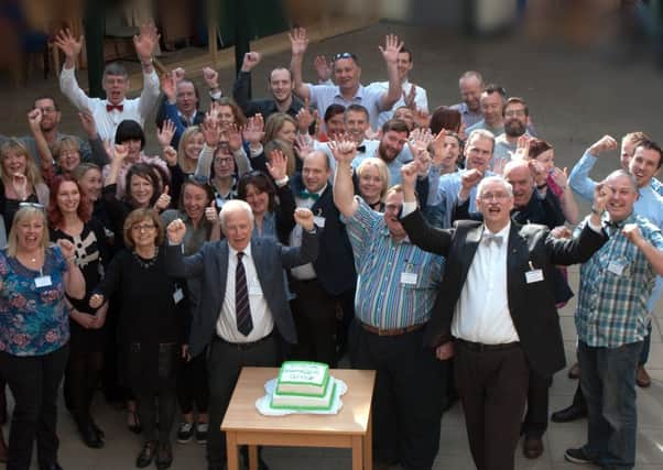 YMCA DownsLink Group managers celebrate the merger of the Sussex Central Guildford YMCAs centres - picture submitted