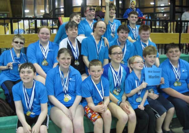 Happy swimmers with their medals