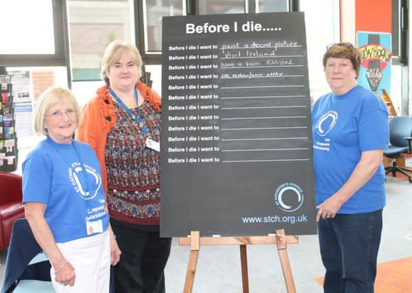 Gina Starnes, Director of Nursing at St Catherines Hospice and volunteers Barbara Pavitt and Stella Owens with our chalkboard